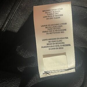 Donna Ricki Black Garment with Care Label